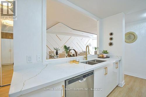 713 - 35 Trailwood Drive, Mississauga, ON - Indoor Photo Showing Kitchen With Double Sink