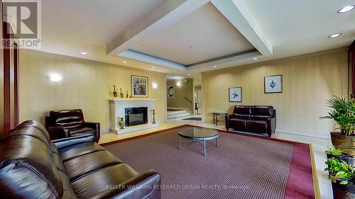 303 - 14 Neilson Drive, Toronto, ON - Indoor Photo Showing Living Room With Fireplace