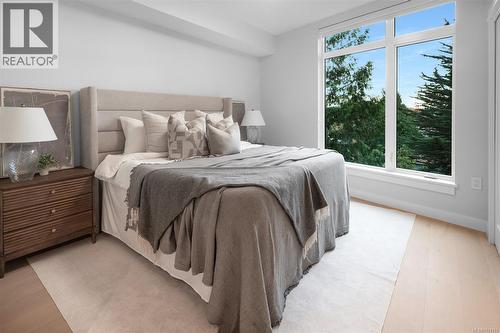 Show suite image used for finishings reference. Layout differs in the listed unit. - 206 5229 Cordova Bay Rd, Saanich, BC - Indoor Photo Showing Bedroom