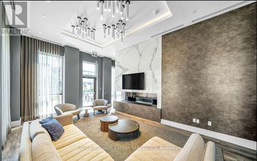 2421 - 2550 Simcoe Street N, Oshawa (Windfields), ON - Indoor Photo Showing Living Room With Fireplace