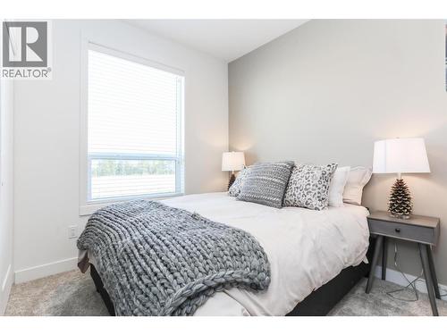 Similar too  - Third Bedroom - 610 Academy Way Unit# 101, Kelowna, BC - Indoor Photo Showing Bedroom