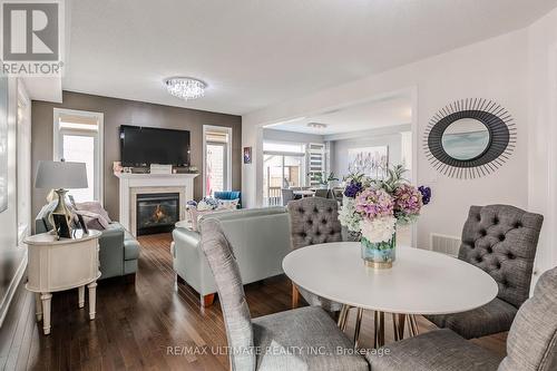 47 Lewis Avenue, Bradford West Gwillimbury, ON - Indoor Photo Showing Dining Room With Fireplace