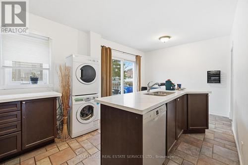 Convenient Laundry Area in the Gourmet Kitchen - 2299 Wiseman Court, Mississauga, ON - Indoor Photo Showing Laundry Room