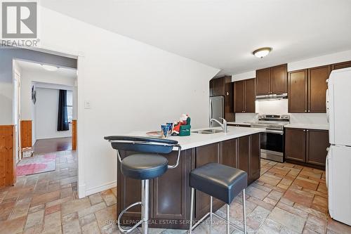 Large Island with Breakfast Bar for Casual Dining - 2299 Wiseman Court, Mississauga, ON - Indoor Photo Showing Kitchen With Stainless Steel Kitchen