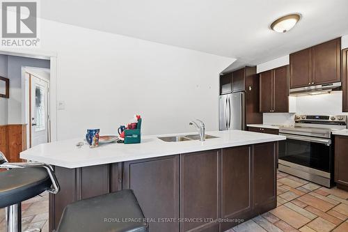 Large Island with Breakfast Bar for Casual Dining - 2299 Wiseman Court, Mississauga, ON - Indoor Photo Showing Kitchen With Stainless Steel Kitchen With Double Sink