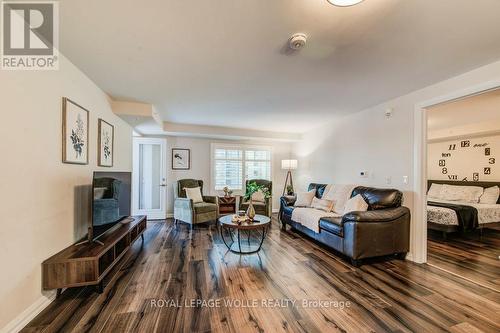 403 - 778 Laurelwood Drive, Waterloo, ON - Indoor Photo Showing Living Room With Fireplace