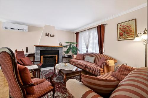 Living room - 17790 Rue Antoine-Faucon, Montréal (Pierrefonds-Roxboro), QC - Indoor Photo Showing Living Room With Fireplace