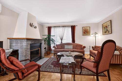 Living room - 17790 Rue Antoine-Faucon, Montréal (Pierrefonds-Roxboro), QC - Indoor Photo Showing Living Room With Fireplace