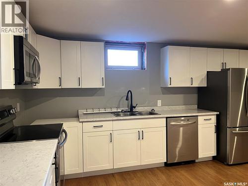 165 Pasqua Street N, Regina, SK - Indoor Photo Showing Kitchen With Double Sink