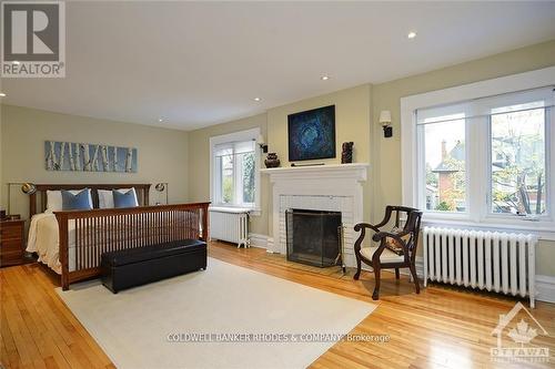 62 Powell Avenue, Ottawa, ON - Indoor Photo Showing Bedroom With Fireplace