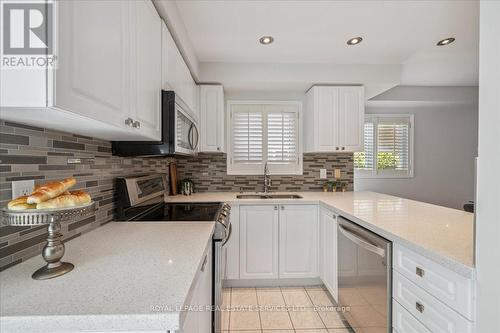 2365 Grand Ravine Drive, Oakville, ON - Indoor Photo Showing Kitchen With Fireplace With Double Sink