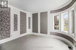 Curved wall Living Room to the right of the entry - 