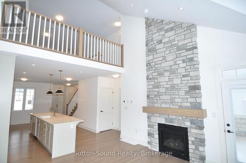 View to loft - 306 Sandpiper Lane, Georgian Bluffs, ON - Indoor Photo Showing Other Room With Fireplace