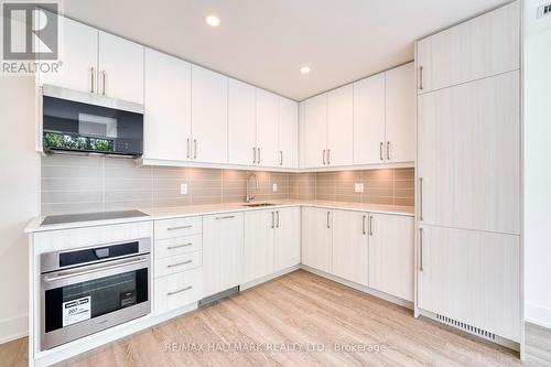 247 - 2075 King Road, King, ON - Indoor Photo Showing Kitchen