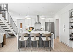 Kitchen - Photo of a similar home in the community. - 