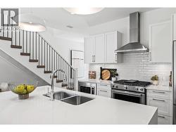 Kitchen - Photo of a similar home in the community. - 