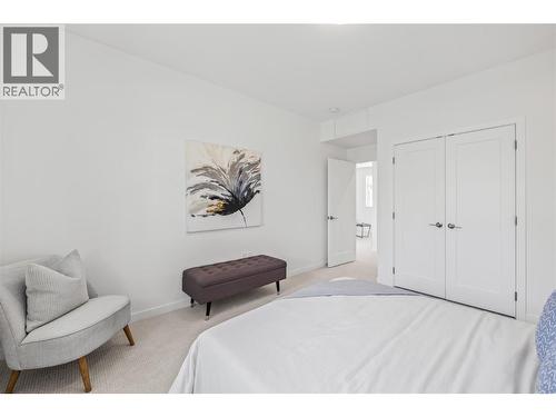 Second bedroom - Photo of a similar home in the community. - 1979 Country Club Drive Unit# 7, Kelowna, BC - Indoor Photo Showing Bedroom
