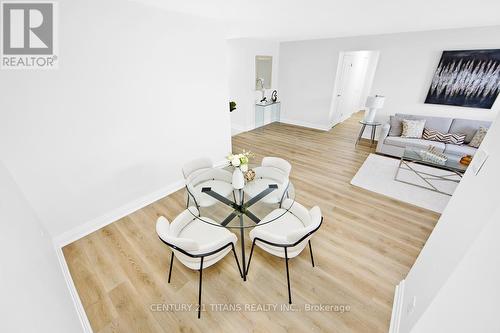 201 - 100 Wingarden Court, Toronto, ON - Indoor Photo Showing Living Room