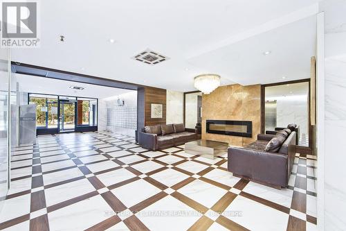 201 - 100 Wingarden Court, Toronto, ON - Indoor With Fireplace