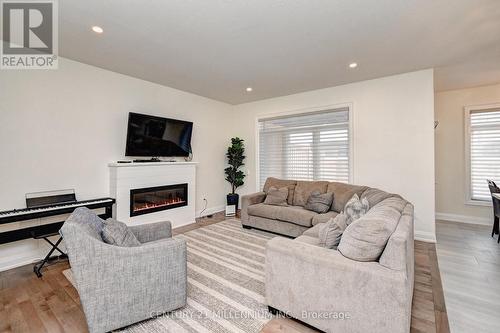 138 Woodberry Crescent, Woolwich, ON - Indoor Photo Showing Living Room With Fireplace