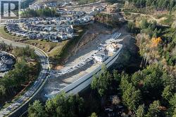 Aerial overview of property's location with nearby suburban area - 