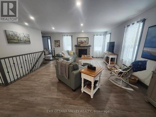1485 Rapid Road, Whitewater Region, ON - Indoor Photo Showing Living Room With Fireplace