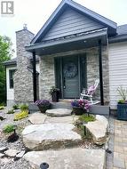 Natural stone steps to composite deck porch. - 