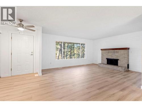 4019 Miller Road, Kelowna, BC - Indoor Photo Showing Living Room With Fireplace