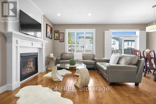 2221 Tribalwood Street, London North (North E), ON - Indoor Photo Showing Living Room With Fireplace