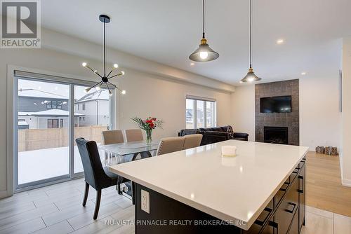 1895 Fountain Grass Drive, London South (South B), ON - Indoor Photo Showing Dining Room With Fireplace