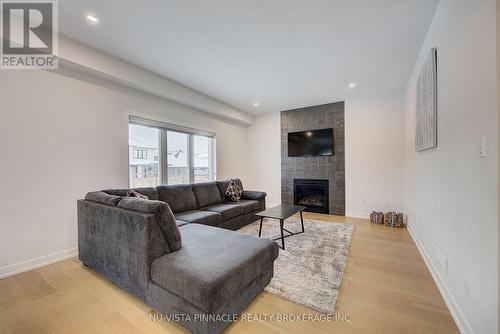 1895 Fountain Grass Drive, London South (South B), ON - Indoor Photo Showing Living Room With Fireplace