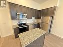103 - 3006 William Cutmore Boulevard, Oakville, ON  - Indoor Photo Showing Kitchen With Stainless Steel Kitchen 