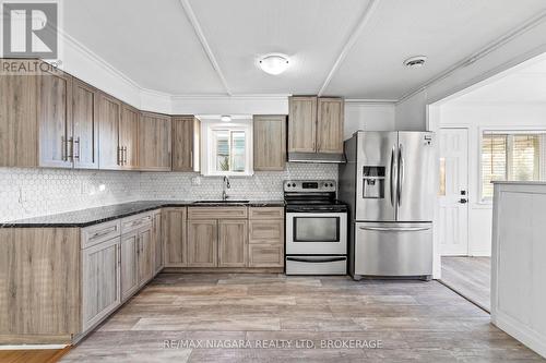 Stone countertop, beautiful backsplash. - 396 Fairview Road, Fort Erie (Crescent Park), ON - Indoor Photo Showing Kitchen With Stainless Steel Kitchen