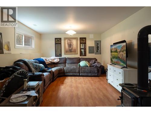 Family room (wood stove is not WETT Certified) included as is. - 5712 6 Highway, Vernon, BC - Indoor Photo Showing Living Room