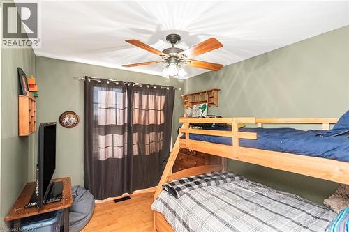 Bedroom with wood finished floors and ceiling fan - 7087 Rainham Road, Dunnville, ON - Indoor Photo Showing Bedroom
