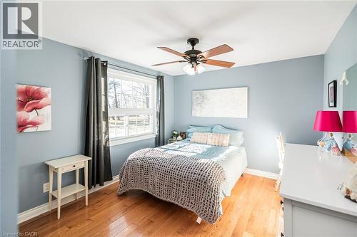 Bedroom with light wood-type flooring and a ceiling fan - 7087 Rainham Road, Dunnville, ON - Indoor Photo Showing Bedroom