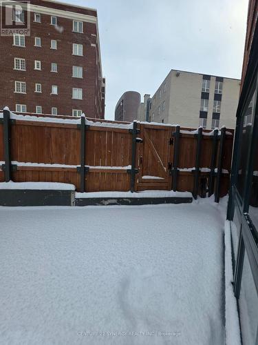a gate to theparking lot next door - 104 - 295 Gilmour Street, Ottawa, ON - Outdoor