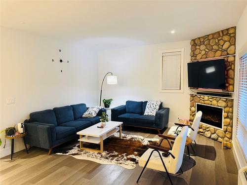 501-7291 Prospector Avenue, Radium Hot Springs, BC - Indoor Photo Showing Living Room With Fireplace