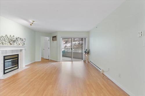 403-3806 35 Avenue, Vernon, BC - Indoor Photo Showing Living Room With Fireplace