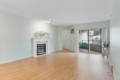403-3806 35 Avenue, Vernon, BC - Indoor Photo Showing Living Room With Fireplace
