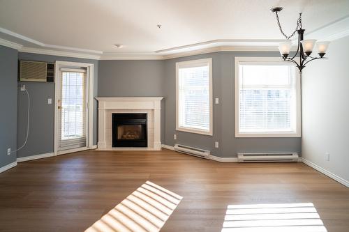 213-3300 Centennial Drive, Vernon, BC - Indoor Photo Showing Living Room With Fireplace
