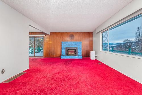 6920 Buchanan Road, Coldstream, BC - Indoor With Fireplace