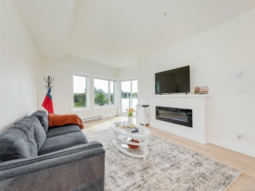 307-7098 Wallace Dr, Central Saanich, BC - Indoor Photo Showing Living Room With Fireplace