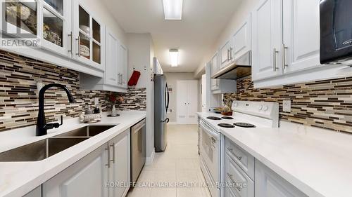 1001 - 25 Silver Springs Boulevard, Toronto, ON - Indoor Photo Showing Kitchen With Double Sink