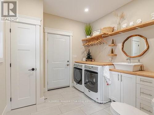 Main bath with access to backyard and dog run. - 8037 Springwater Road, Central Elgin, ON 