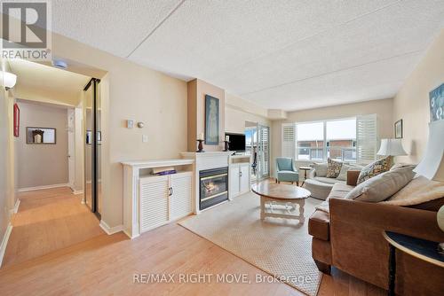 204 - 54 Fittons Road W, Orillia, ON - Indoor Photo Showing Living Room With Fireplace