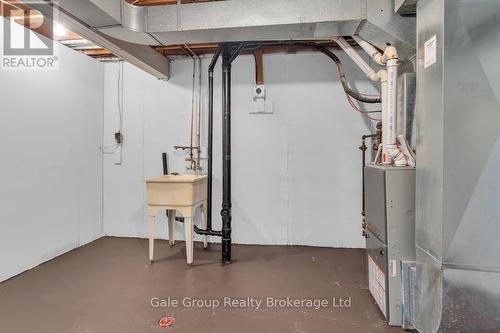 Laundry - 63 Tennyson Street, Woodstock (Woodstock - South), ON - Indoor Photo Showing Basement