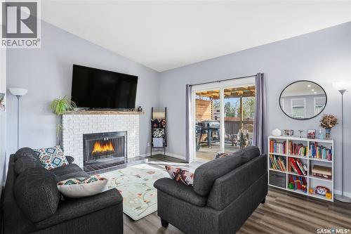 86 Mackenzie Crescent, Regina, SK - Indoor Photo Showing Living Room With Fireplace