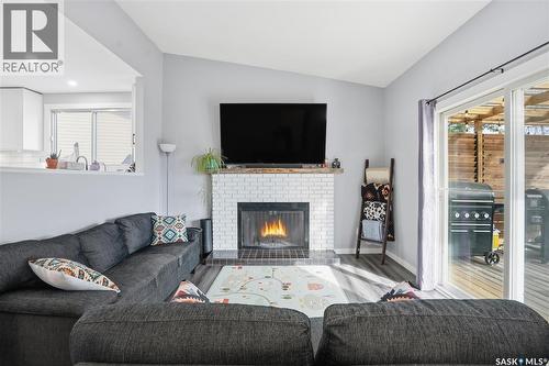 86 Mackenzie Crescent, Regina, SK - Indoor Photo Showing Living Room With Fireplace