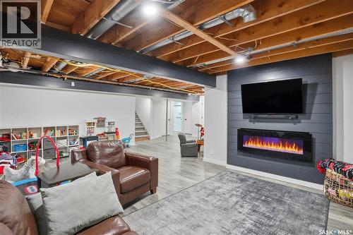 86 Mackenzie Crescent, Regina, SK - Indoor Photo Showing Basement With Fireplace